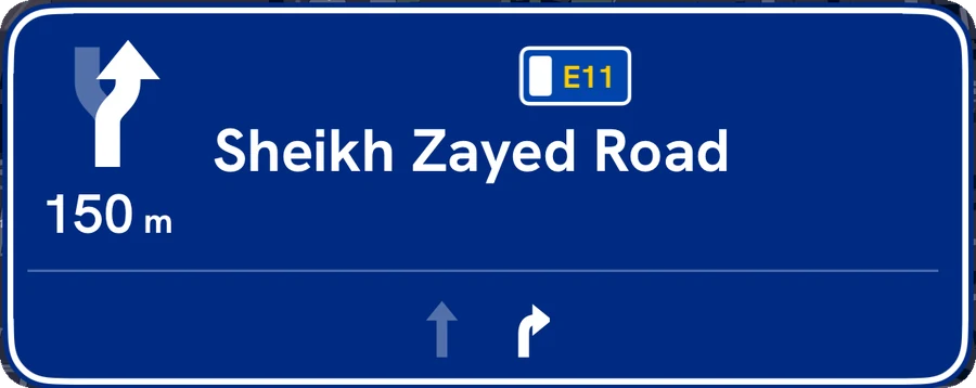 Blue motorway sign: Sheikh Zayed Road in 150 m, with lane arrows